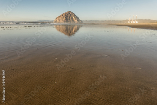 Reflection of Morro rock and power plant at low tide