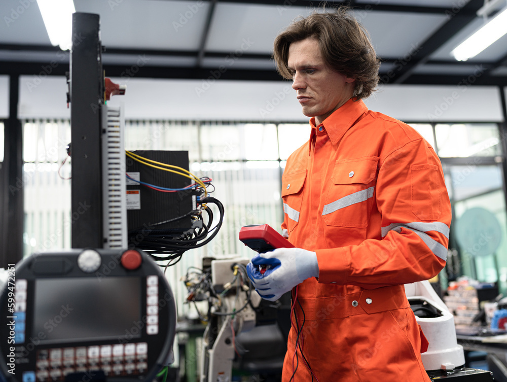 Caucasian technician engineer man with checking and repair electric machine	