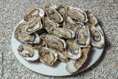 Oysters on a dish ready for consumption.