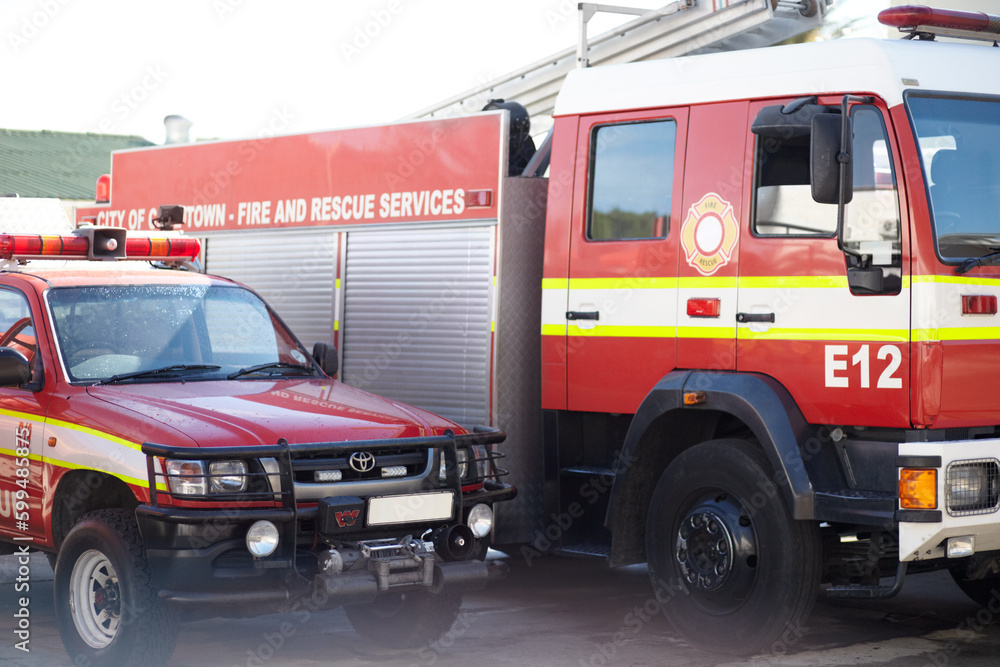Fire engine, truck and rescue services at station ready for firefighting, emergency and transportation. Firefighter vehicles parked outside for safety, transport and equipment for brigade protection