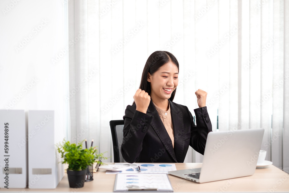 Smart business woman is sitting at workplace and glad that the work has been accomplished according to the goal. Smart business woman is sitting at workplace and glad that the work has been accomplished according to the goal.