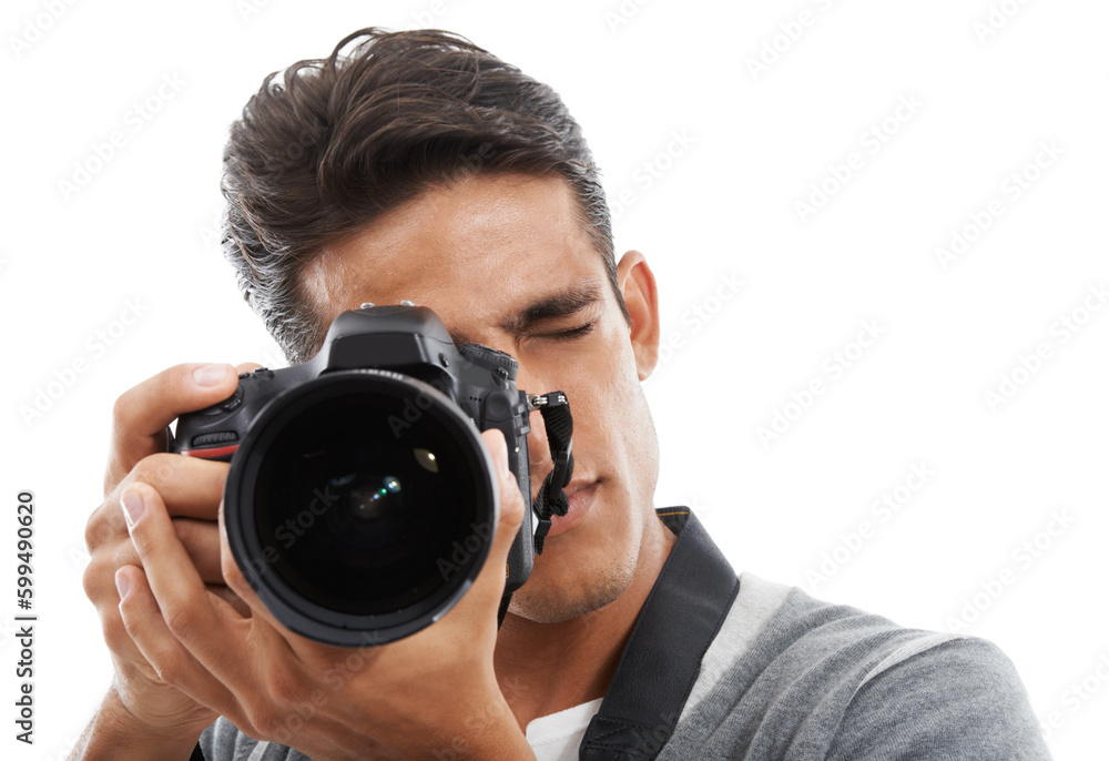 Hes got an eye for photography. Portrait of a young man holding a camera and taking pictures against a white background.