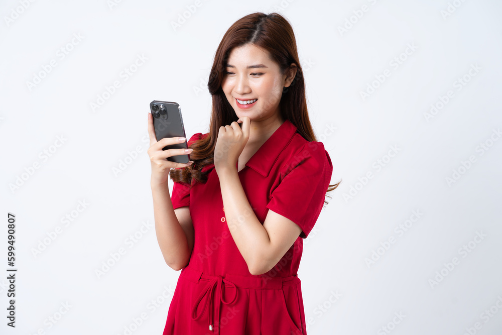 Portrait of a beautiful, charming lady wearing a red dress on a white background Portrait of a beautiful, charming lady wearing a red dress on a white background