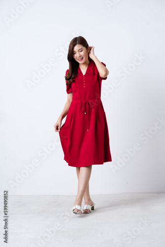 Wallpaper Mural Portrait of a beautiful, charming lady wearing a red dress on a white background Torontodigital.ca