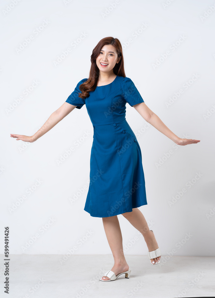 Asian girl portrait in blue dress on white background Asian girl portrait in blue dress on white background