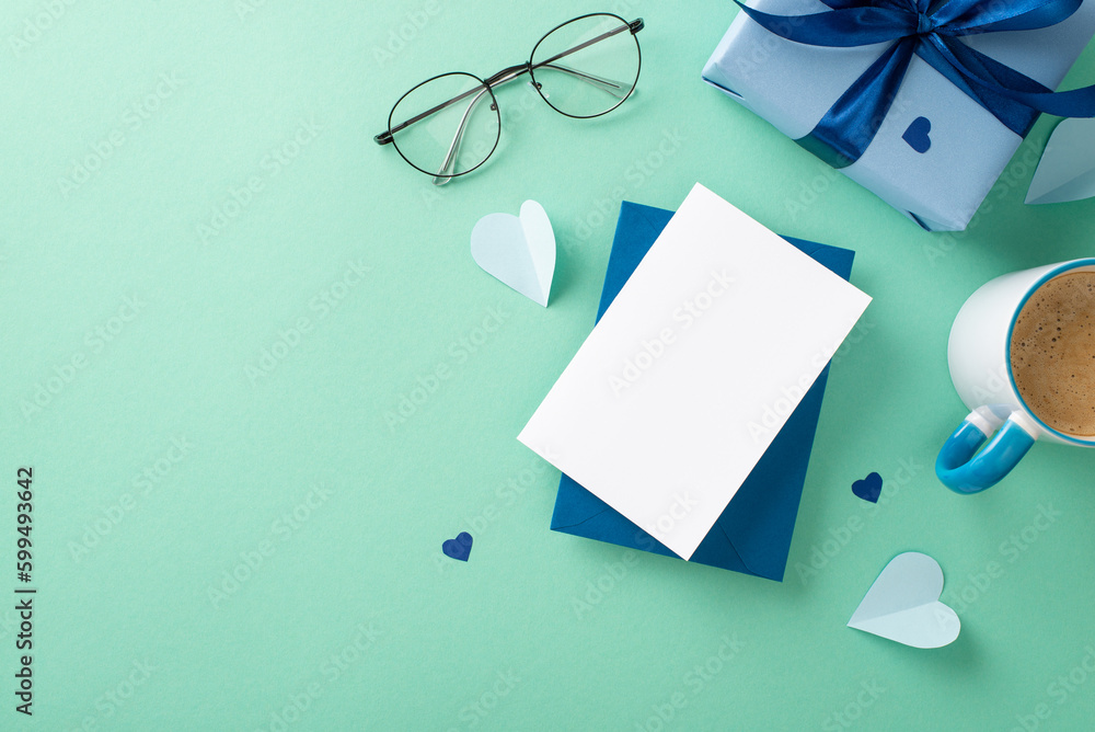Minimalist Father's Day design. Top view arrangement of giftbox, spectacles, hearts, envelope with paper sheet, and coffee cup on teal surface with space for text Minimalist Father's Day design. Top view arrangement of giftbox, spectacles, hearts, envelope with paper sheet, and coffee cup on teal surface with space for text