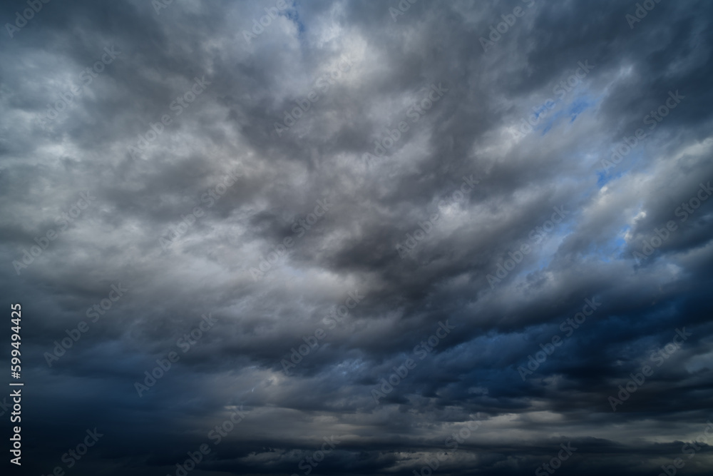 storm sky, dark dramatic clouds during thunderstorm, rain and wind, extreme weather, abstract background