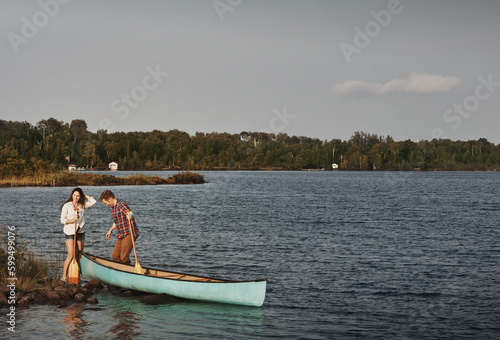 Nature lovers in their element. a young couple going for a canoe ride on the lake.