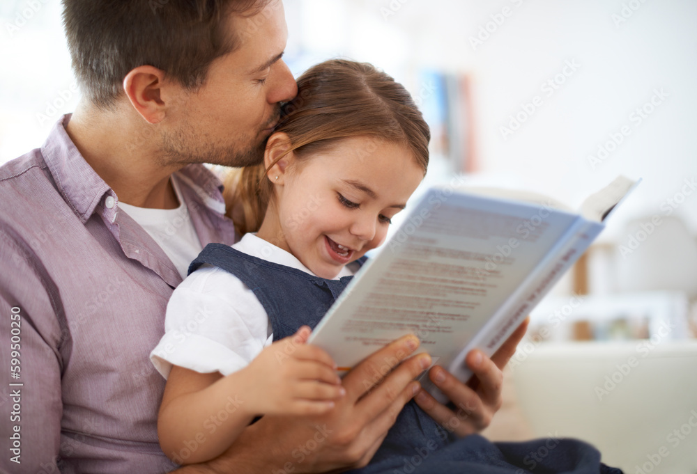 Shes the princess in my story. a young father reading a book with his daughter. Shes the princess in my story. a young father reading a book with his daughter.