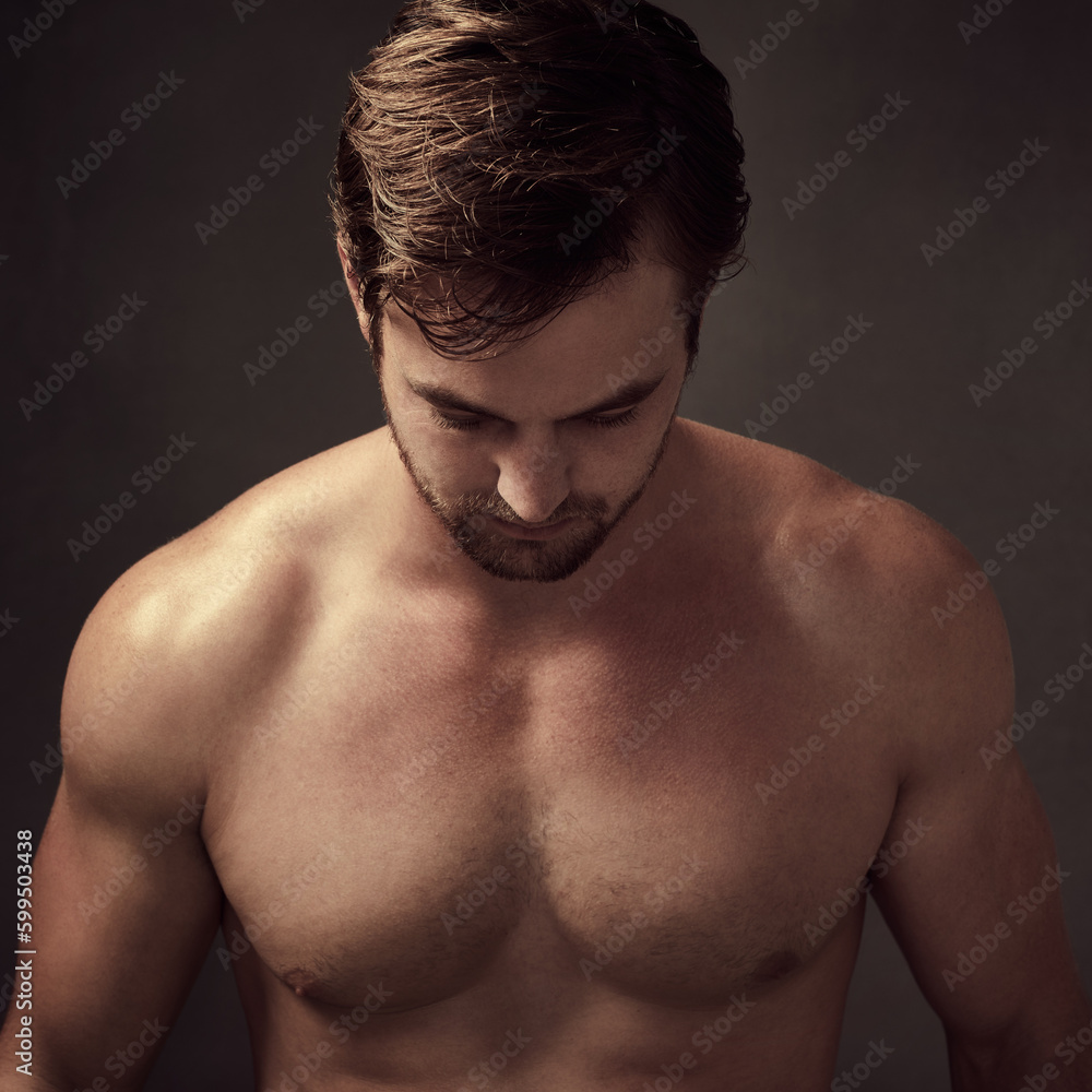 Keeping your hair clean is important. a handsome young man against a dark background. Keeping your hair clean is important. a handsome young man against a dark background.