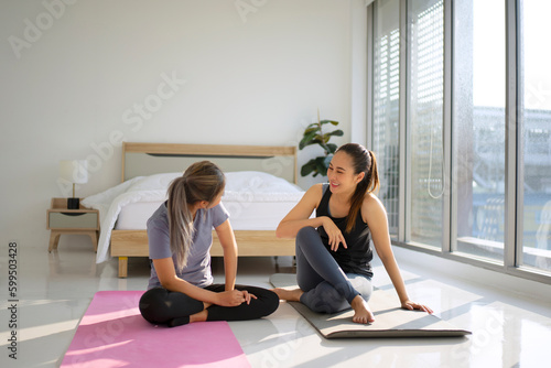 Women play yoga at home.