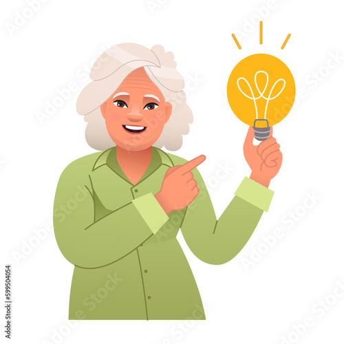 Elderly woman holds a light bulb in her hand. Old lady has an idea. Portrait of a happy pensioner. Smart white granny with an idea of how to solve the problem.