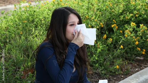 Allergy Woman Blue Top Sneezes and Grabs Tissue Close
