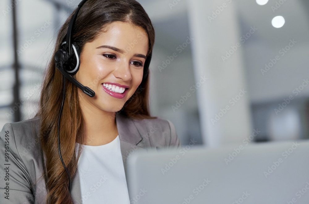 Going the extra mile is never an effort for her. a young call centre agent working in an office. Going the extra mile is never an effort for her. a young call centre agent working in an office.
