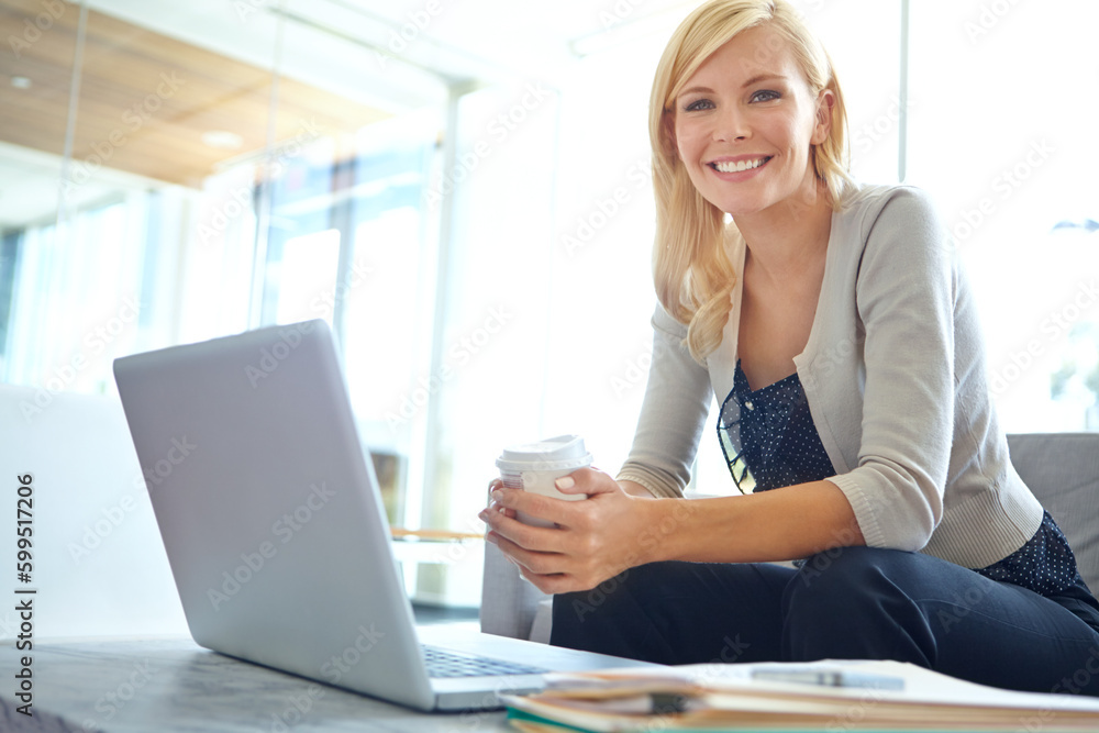 Success in the working field. Portrait of a smiling corporate woman sitting in front of her laptop with a takeaway coffee in her hand. Success in the working field. Portrait of a smiling corporate woman sitting in front of her laptop with a takeaway coffee in her hand.