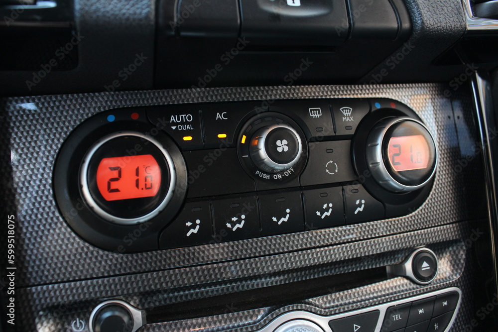 Car climate control. Detail air conditioning button inside a car. Car interior detail. Closeup image of air control panel inside of the car.