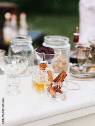 Cinnamon sticks in a glass. Outside bar in the open air.