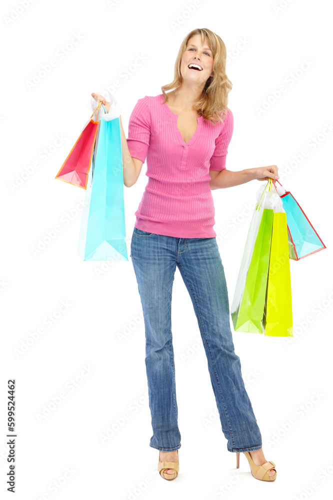 Spotting something she really likes. Full length of a pretty young woman holding shopping bags while isolated on white. Spotting something she really likes. Full length of a pretty young woman holding shopping bags while isolated on white.