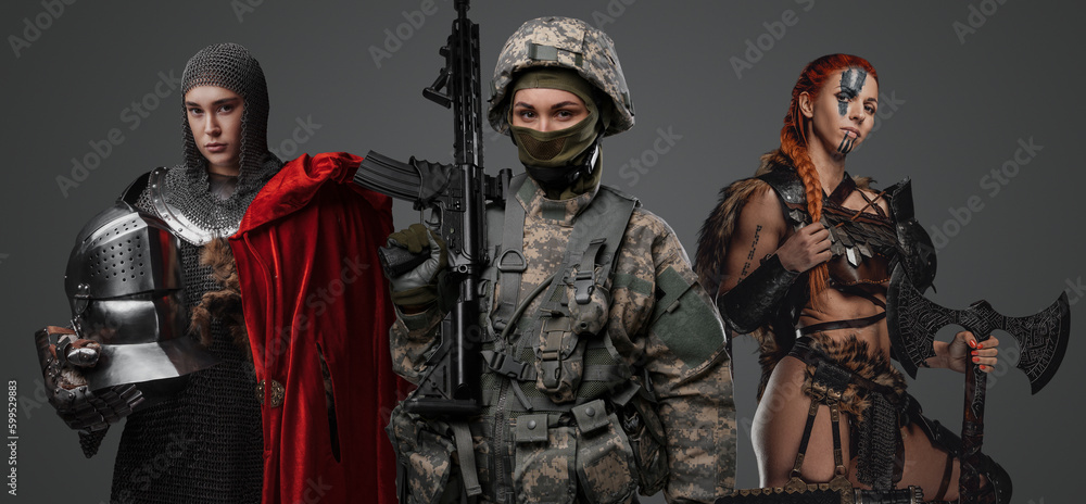 Obraz premium Studio shot of female soldier holding rifle with ancient amazon and knight woman.
