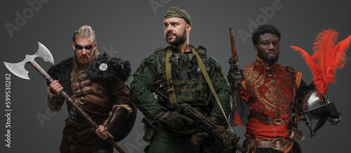 Studio shot of special forces soldier with nordic warrior and black conquistador. © Fxquadro