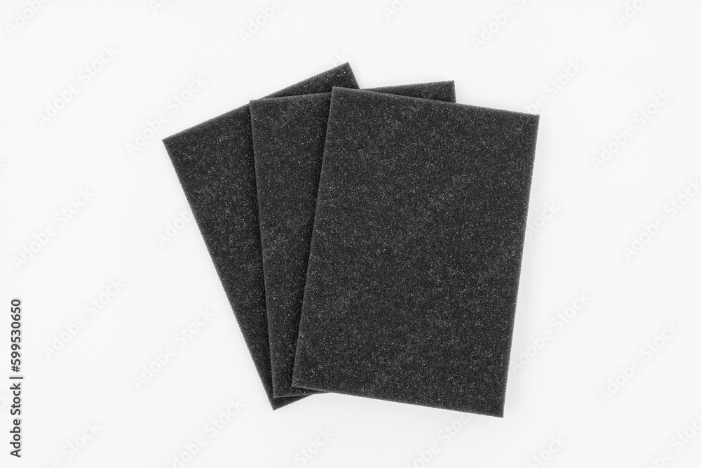 Three black sponge isolated on white. Three black sponge isolated on white.