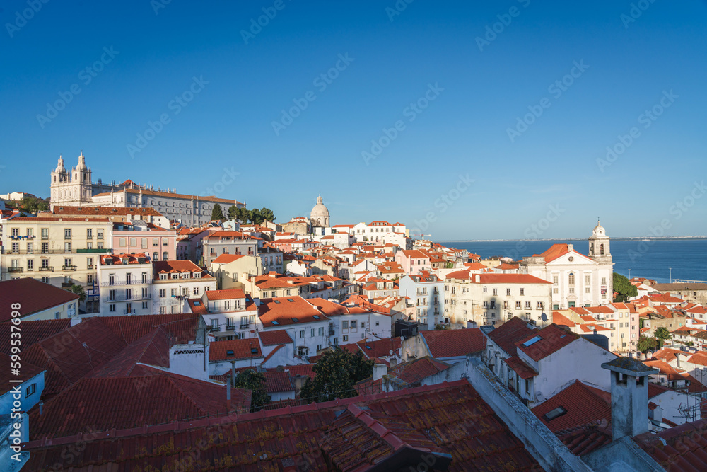 City skyline of the old Alfama district in Lisbon at dusk