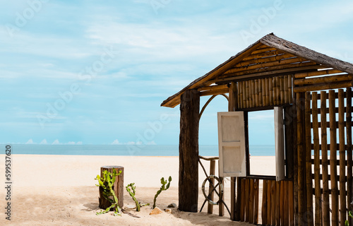 Wooden window frame by the sea in sunny day Summer,Beach hut on sandy beach with window open through ocean sea view,Seaside view point for Summer Holiday promotion or Product presentation background © Anchalee