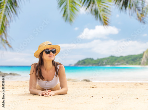 Woman lying on the sea beach