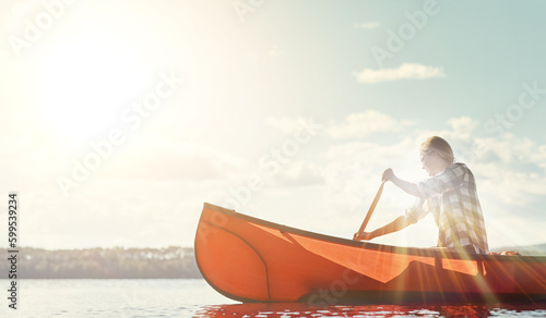 Another weekend, another kayaking adventure. an attractive young woman spending a day kayaking on the lake.