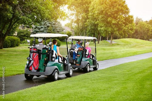 Getting a great foursome together for some golf. four people out on a double date on a golf course.