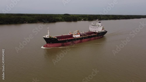 Orbit Shot Of Large Oil Products Tanker Ship Sailing In Parana River, Hidrovia, Argentina photo