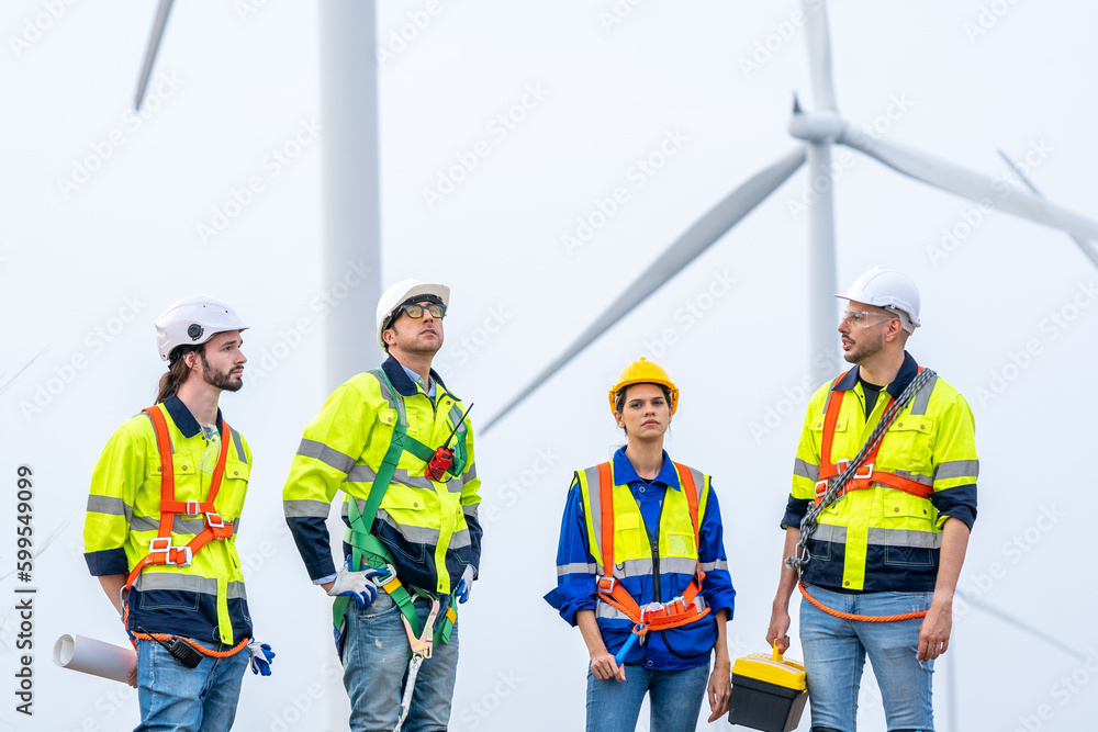 Power engineer are working with wind turbines,Green ecological power energy generation wind sustainable energy concept. Power engineer are working with wind turbines,Green ecological power energy generation wind sustainable energy concept.