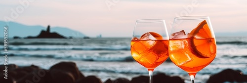 Refreshing Seaside Aperol Spritz, Classic Italian Aperitif Cocktail with Stunning Beach View, Perfect for a Relaxing Vacation. Generative AI © Александр Марченко