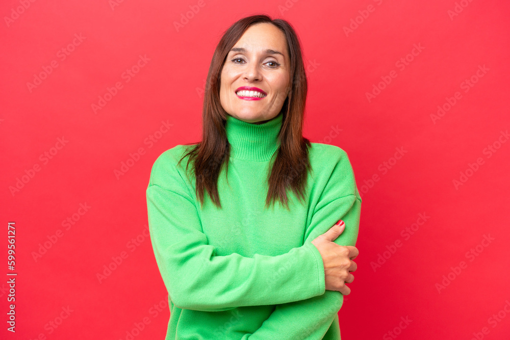 Middle-aged caucasian woman isolated on red background laughing Middle-aged caucasian woman isolated on red background laughing