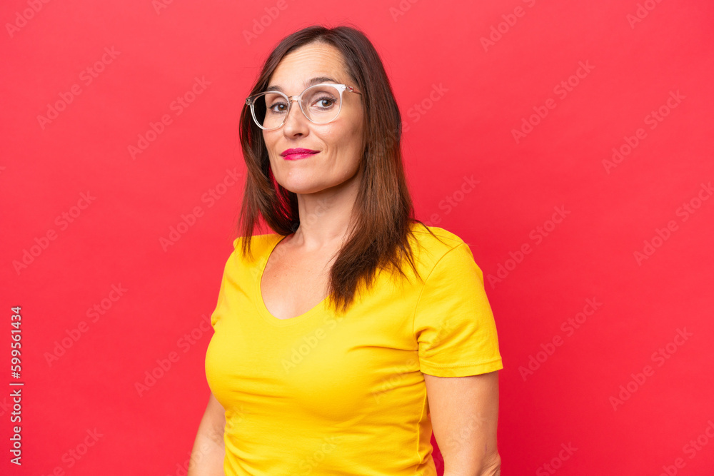 Middle-aged caucasian woman isolated on red background . Portrait Middle-aged caucasian woman isolated on red background . Portrait