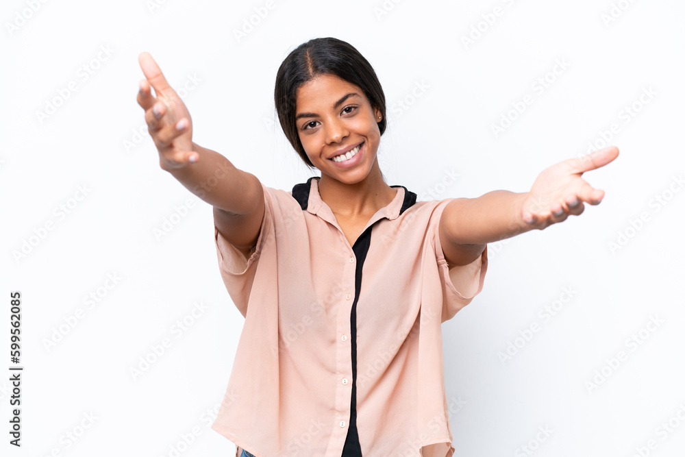 Young African american woman isolated on white background presenting and inviting to come with hand Young African american woman isolated on white background presenting and inviting to come with hand