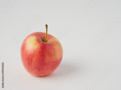 A red apple isolated on a white background with a cropped outline and full depth of field