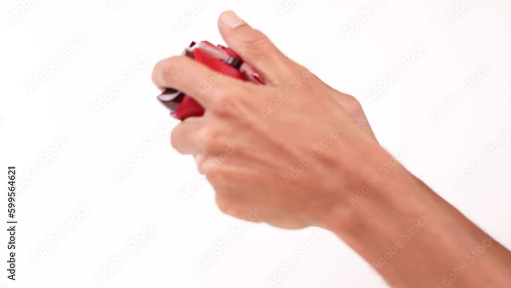 Male Hands on a controller playing video games isolated on white celebrating victory Male Hands on a controller playing video games isolated on white celebrating victory