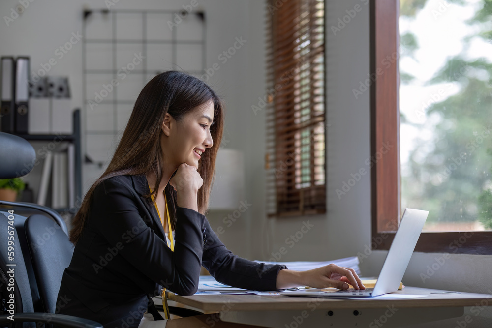 Business asian woman using calculator for do math finance on wooden desk in office, tax, accounting, financial concept. Business asian woman using calculator for do math finance on wooden desk in office, tax, accounting, financial concept.