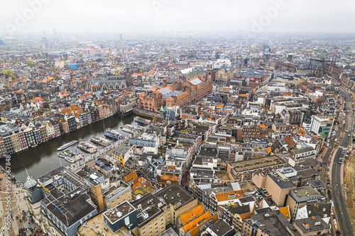 Amsterdam Center on a cloudy day, aerial shot. beautiful buildings, houses and canals. High quality photo