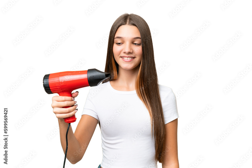 Teenager Caucasian girl holding a hairdryer over isolated background with happy expression Teenager Caucasian girl holding a hairdryer over isolated background with happy expression