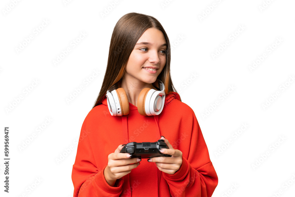 Teenager caucasian girl playing with a video game controller over isolated background looking to the side and smiling Teenager caucasian girl playing with a video game controller over isolated background looking to the side and smiling