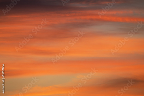 Beautiful clouds in the sunset light. Abstract composition of dramatic sky.