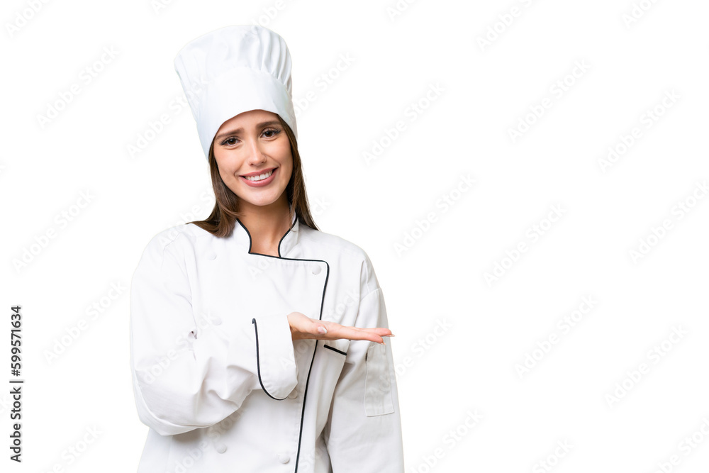 Young chef caucasian woman over isolated background presenting an idea while looking smiling towards Young chef caucasian woman over isolated background presenting an idea while looking smiling towards