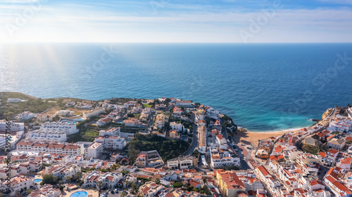 Aerial view of portuguese tourist village Carvoeiro Portugal Algarve in summer on a sunny day. Blue sea