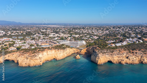 Aerial view of the rocky shores of the village of Carvoeiro in the southern zone of the Algarve. Tourist hotels on the coast.