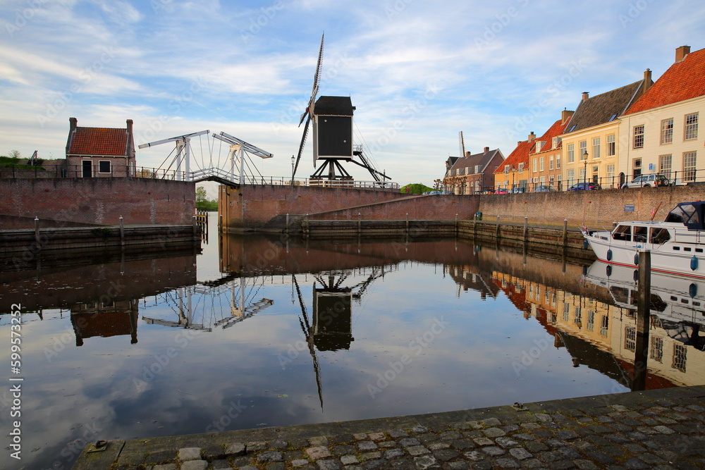 The old Harbor of Heusden, North Brabant, Netherlands, a fortified city located 19km far from Hertogenbosch, with a drawbridge and a windmill