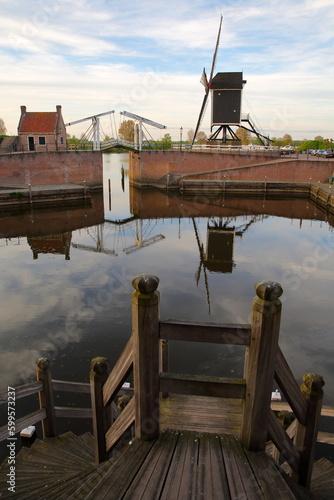 The old Harbor of Heusden, North Brabant, Netherlands, a fortified city located 19km far from Hertogenbosch, with a drawbridge and a windmill photo