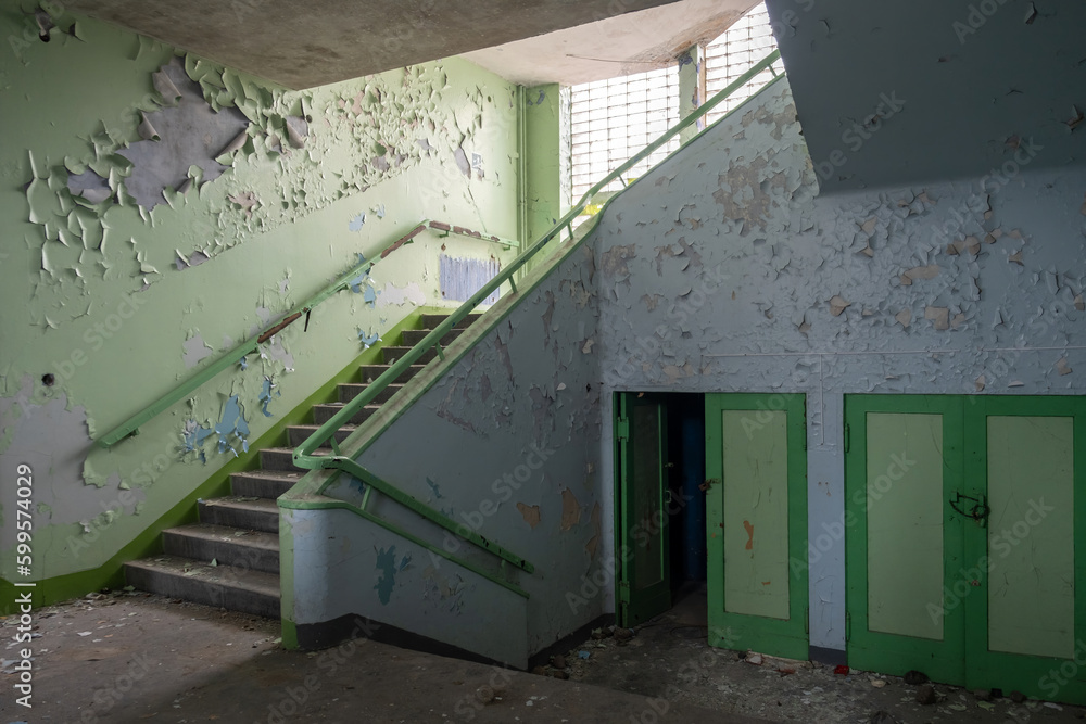 corridor with stairs in an abandoned old school corridor with stairs in an abandoned old school