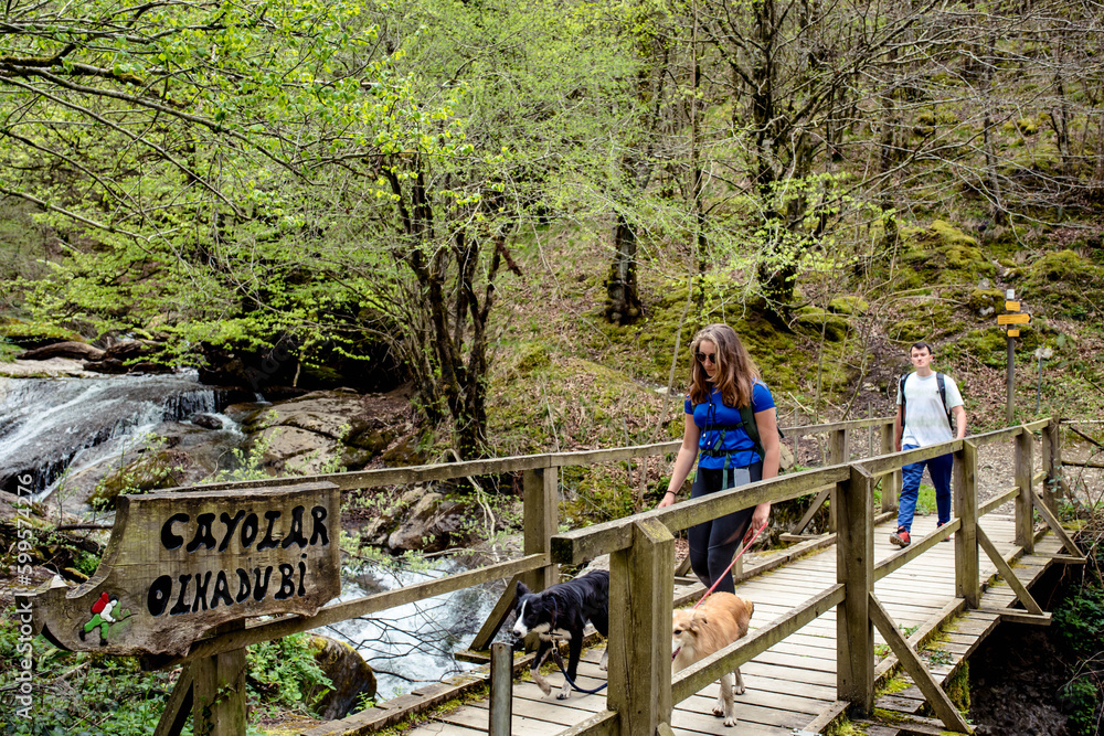 Young couple in sportswear doing a breack during a hike near Holzarté in the French Basque Country Young couple in sportswear doing a breack during a hike near Holzarté in the French Basque Country
